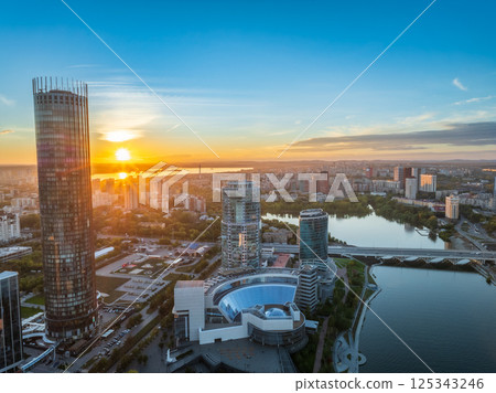 Yekaterinburg city and pond aerial panoramic view at summer or early autumn sunset. Night city in the early autumn or summer. 125343246