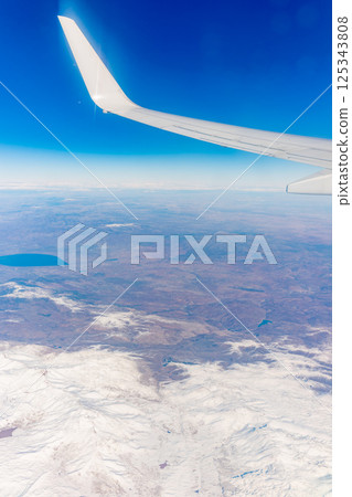 Aerial view on arabian desert and Red sea mountains from airplane 125343808