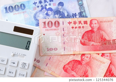 Republic of China (Taiwan) currency, New Taiwan Dollar (TWD) banknotes and calculator Republic of China (Taiwan) currency, New Taiwan Dollar (TWD) banknotes and calculator 125344076