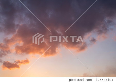 Beautiful Cloudscape During Sunset or Sunrise Hour with Colored Clouds in the Sky Panorama Background. 125345104