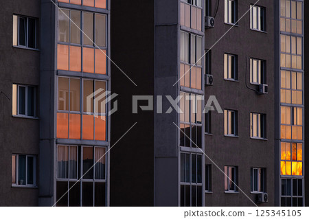 Balcony Windows with Sunlight Reflection on Modern Urban Architecture Facade. 125345105