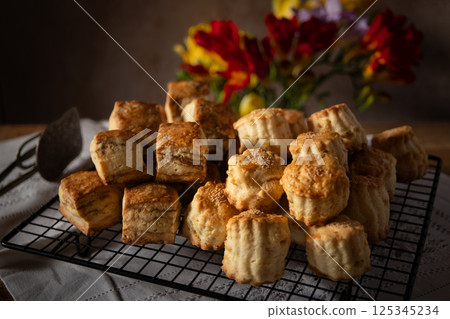 Freshly baked scones and flowers 125345234