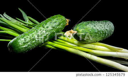 Fresh Cucumbers with Dew Drops on Black Background 125345679