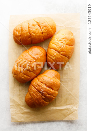 Japanese sea salt butter bread rolls or Shio Pan. 125345919