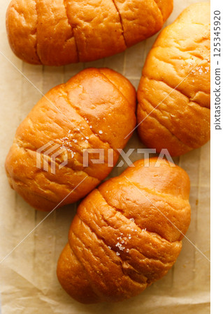 Japanese sea salt butter bread rolls or Shio Pan. 125345920