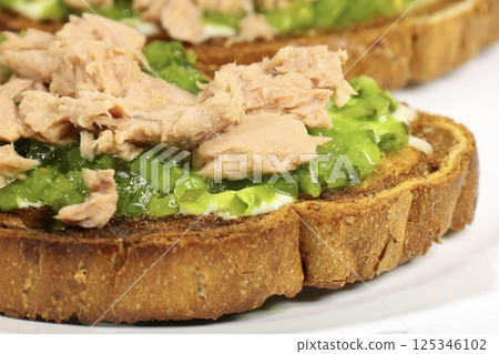crispy toast with tuna and pickles, close up 125346102