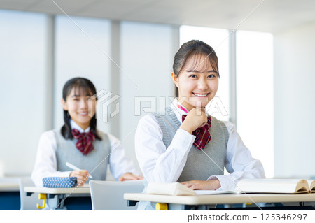 High school girls in class. Photo courtesy of Denpa Gakuen, Tokyo Electronics College. 125346297