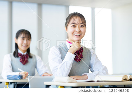 High school girls in class. Photo courtesy of Denpa Gakuen, Tokyo Electronics College. 125346298
