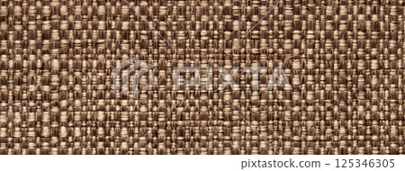 Texture brown color background from woven textile material with wicker pattern, macro. Structure vintage beige fabric Texture brown color background from woven textile material with wicker pattern, macro. Structure vintage beige fabric 125346305