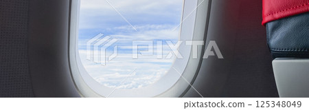 travel and transportation concept with see city and beautiful sky from airplane window 125348049