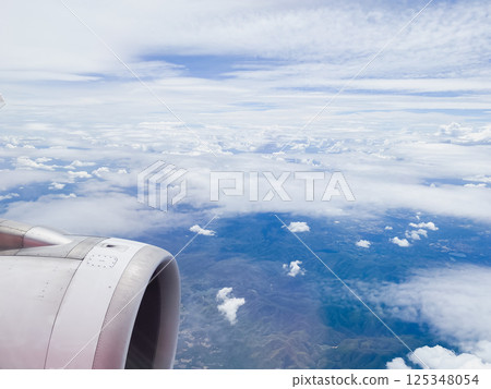 travel and transportation concept with see city and beautiful sky from airplane window 125348054