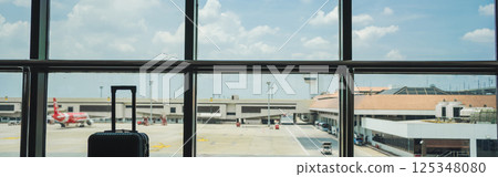 business concept with luggage and window in airport 125348080