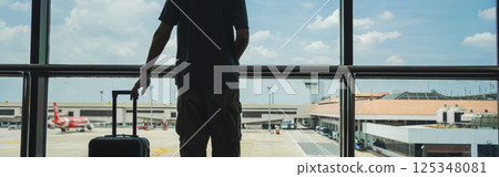 business concept with asian solo traveler wait for boarding time with luggage and seat in airport 125348081