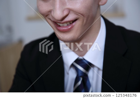 Image of a dishonest salesman with a fearless smile Image of a dishonest salesman with a fearless smile 125348176