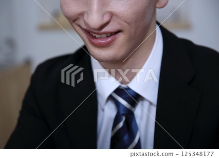 Image of a dishonest salesman with a fearless smile Image of a dishonest salesman with a fearless smile 125348177