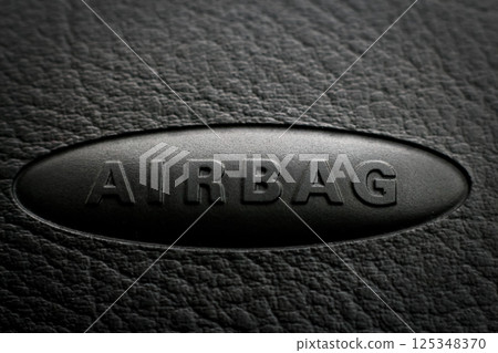 Close-up of airbag inscription on a car dashboard. vehicle safety, automotive design, and passenger protection concept with copy space Close-up of airbag inscription on a car dashboard. vehicle safety, automotive design, and passenger protection concept with copy space 125348370