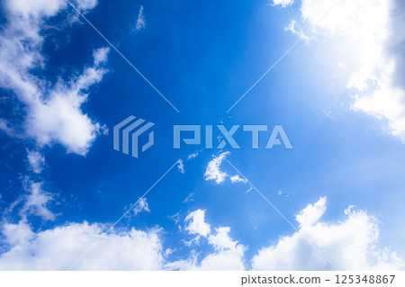 Simple landscape with blue sky and sun clouds Simple landscape with blue sky and sun clouds 125348867