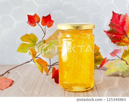 帶有蜂窩和六角形手柄的蜂蜜罐 125348963