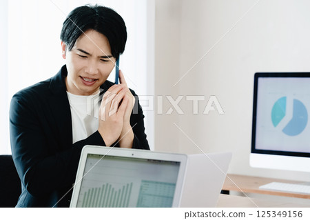 Casual style businessman talking on smartphone 125349156