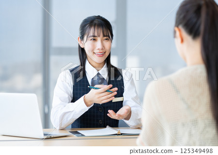 A clerk counseling a young woman. Photo courtesy of Denpa Gakuen, Tokyo Electronics College. A clerk counseling a young woman. Photo courtesy of Denpa Gakuen, Tokyo Electronics College. 125349498