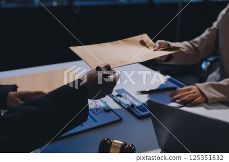 Concept of legal counseling. The lawyer or legal counsel is listening and providing advice to business people. 125351832