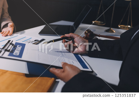 Concept of legal counseling. The lawyer or legal counsel is listening and providing advice to business people. Concept of legal counseling. The lawyer or legal counsel is listening and providing advice to business people. 125351837