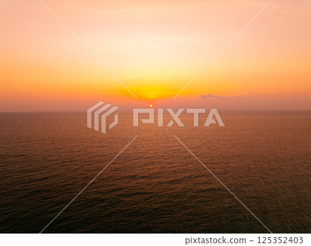 Amazing sunset or sunrise sky over sea landscape,Beautiful colorful light of nature background,Drone camera shot nature view seascape 125352403