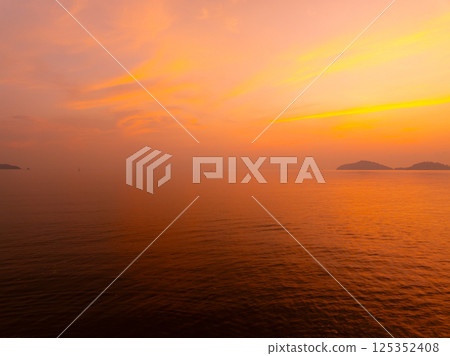 Amazing sunset or sunrise sky over sea landscape,Beautiful colorful light of nature background,Drone camera shot nature view seascape 125352408