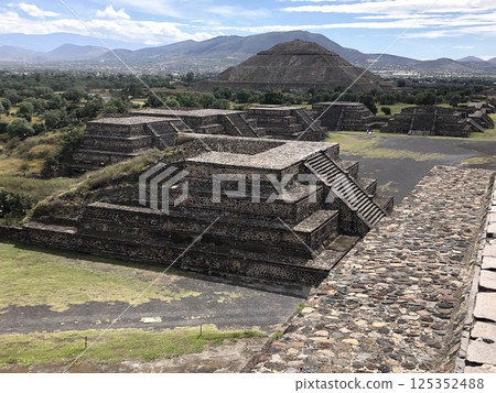 The Pyramid of the Sun is the largest structure in Teotihuacan, Mexico City. Tourists climb the pyramid to see the city The Pyramid of the Sun is the largest structure in Teotihuacan, Mexico City. Tourists climb the pyramid to see the city 125352488