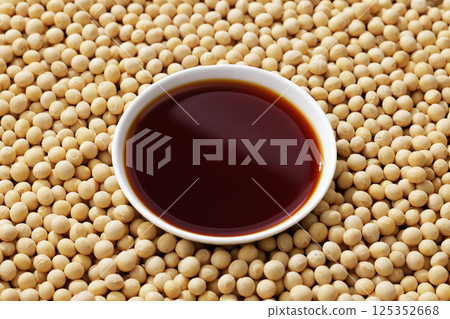 Soybeans and soy sauce poured into a bowl Soybeans and soy sauce poured into a bowl 125352668