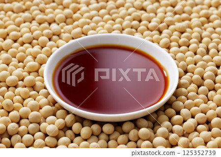 Soybeans and soy sauce poured into a bowl Soybeans and soy sauce poured into a bowl 125352739