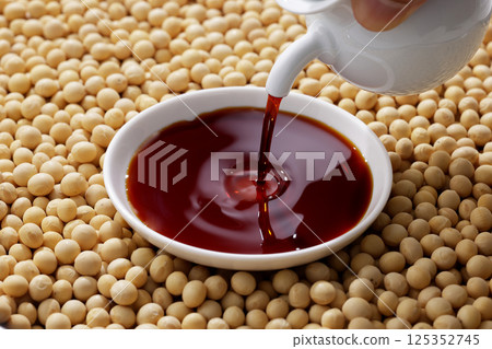 Soybeans and soy sauce poured into a bowl Soybeans and soy sauce poured into a bowl 125352745