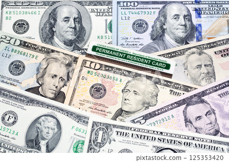 American permanent resident card on a US money American permanent resident card on a US money 125353420