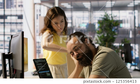 Tired company worker caught falling asleep at desk in office by colleague, laughing about it. Exhausted man sleeping in front of computer screen in workplace, woken up by amused coworker, camera A Tired company worker caught falling asleep at desk in office by colleague, laughing about it. Exhausted man sleeping in front of computer screen in workplace, woken up by amused coworker, camera A 125356413