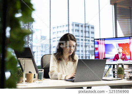 Female executive demonstrates her management skills in a global corporation, driving business deals and partnerships that align with the company vision and development strategy. Office life. 125356900