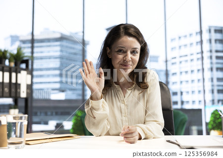 Woman director attending a videocall conference with the advisory board, planning a new investment during decision making meeting online. Shareholders with executive power and CEO discuss target. 125356984
