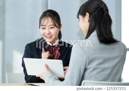 High school girl having an interview. Photo courtesy of Denpa Gakuen, Tokyo Electronics College. 125357251