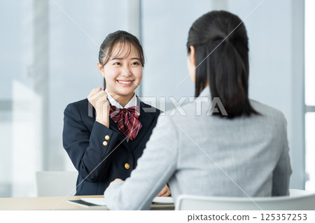 High school girl having an interview. Photo courtesy of Denpa Gakuen, Tokyo Electronics College. 125357253
