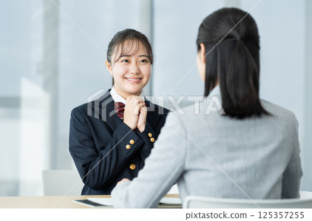 High school girl having an interview. Photo courtesy of Denpa Gakuen, Tokyo Electronics College. 125357255