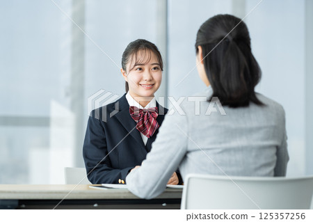 High school girl having an interview. Photo courtesy of Denpa Gakuen, Tokyo Electronics College. High school girl having an interview. Photo courtesy of Denpa Gakuen, Tokyo Electronics College. 125357256