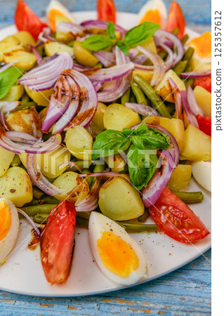 Fresh salad, green beans, small potatoes, egg, tomato, basil, red onions and balsamic vinaigrette Fresh salad, green beans, small potatoes, egg, tomato, basil, red onions and balsamic vinaigrette 125357612
