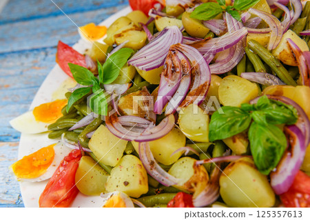 Fresh salad, green beans, small potatoes, egg, tomato, basil, red onions and balsamic vinaigrette Fresh salad, green beans, small potatoes, egg, tomato, basil, red onions and balsamic vinaigrette 125357613