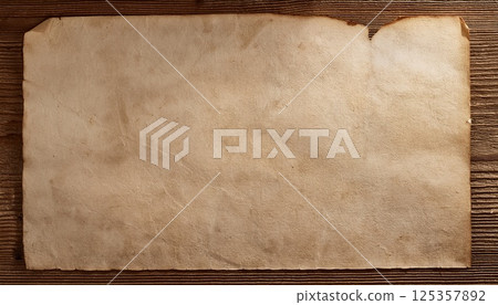 Aged paper texture background on wooden surface - for rustic and vintage designs Aged paper texture background on wooden surface - for rustic and vintage designs 125357892