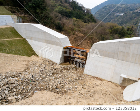 A check dam filled with sand 125358012