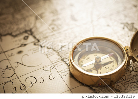 Compass with vintage map Compass with vintage map 125358139