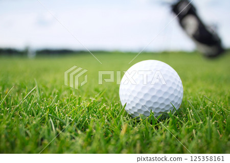 Golf ball on grass 125358161