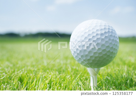 Golf ball on tee 125358177
