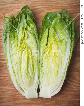 roman lettuce on cutting board roman lettuce on cutting board 125358193