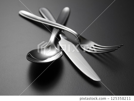 Fork, knife and spoon on table 125358211
