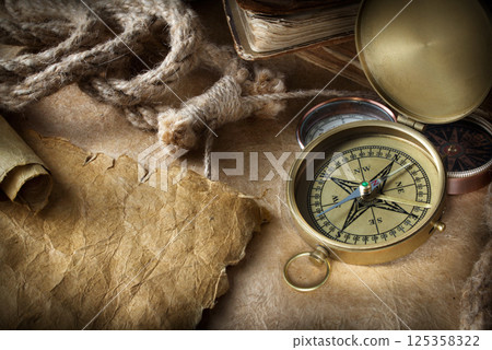 Compass on old paper 125358322